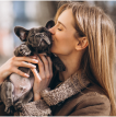 Girl photo kissing a puppy
